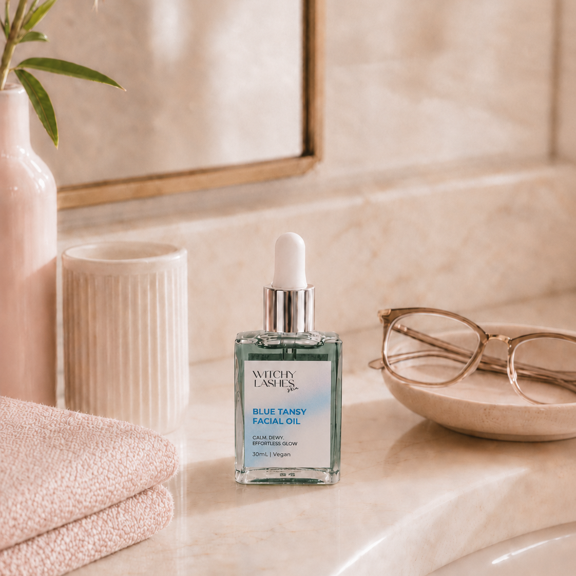 Witchy Lashes Skin Blue Tansy Calming Facial Oil bottle in bathroom setting